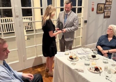 Scholarship Dinner Denise Giving Andrew Tophy